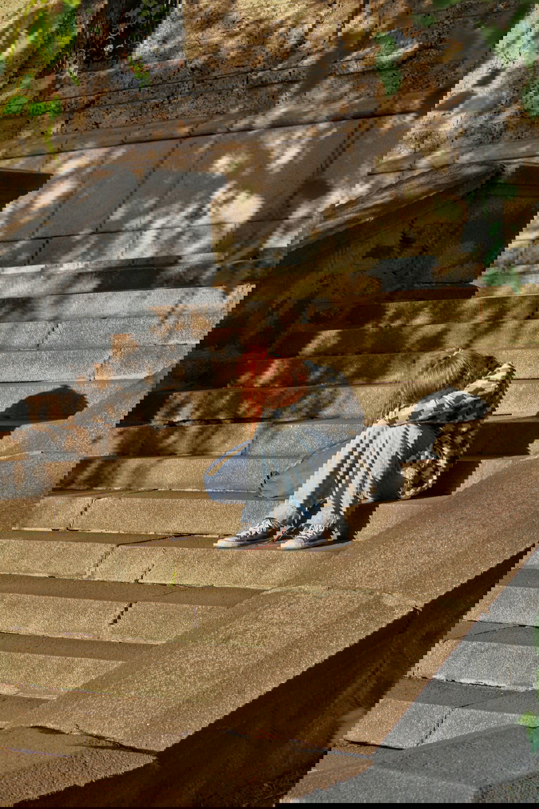 woman-in-black-and-white-dress-sitting-on-concrete-stairs.jpg woman in black and white dress sitting on concrete stairs